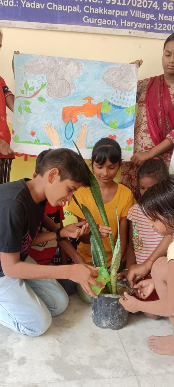 Children watering young plants at Udaan Ki Paathshala