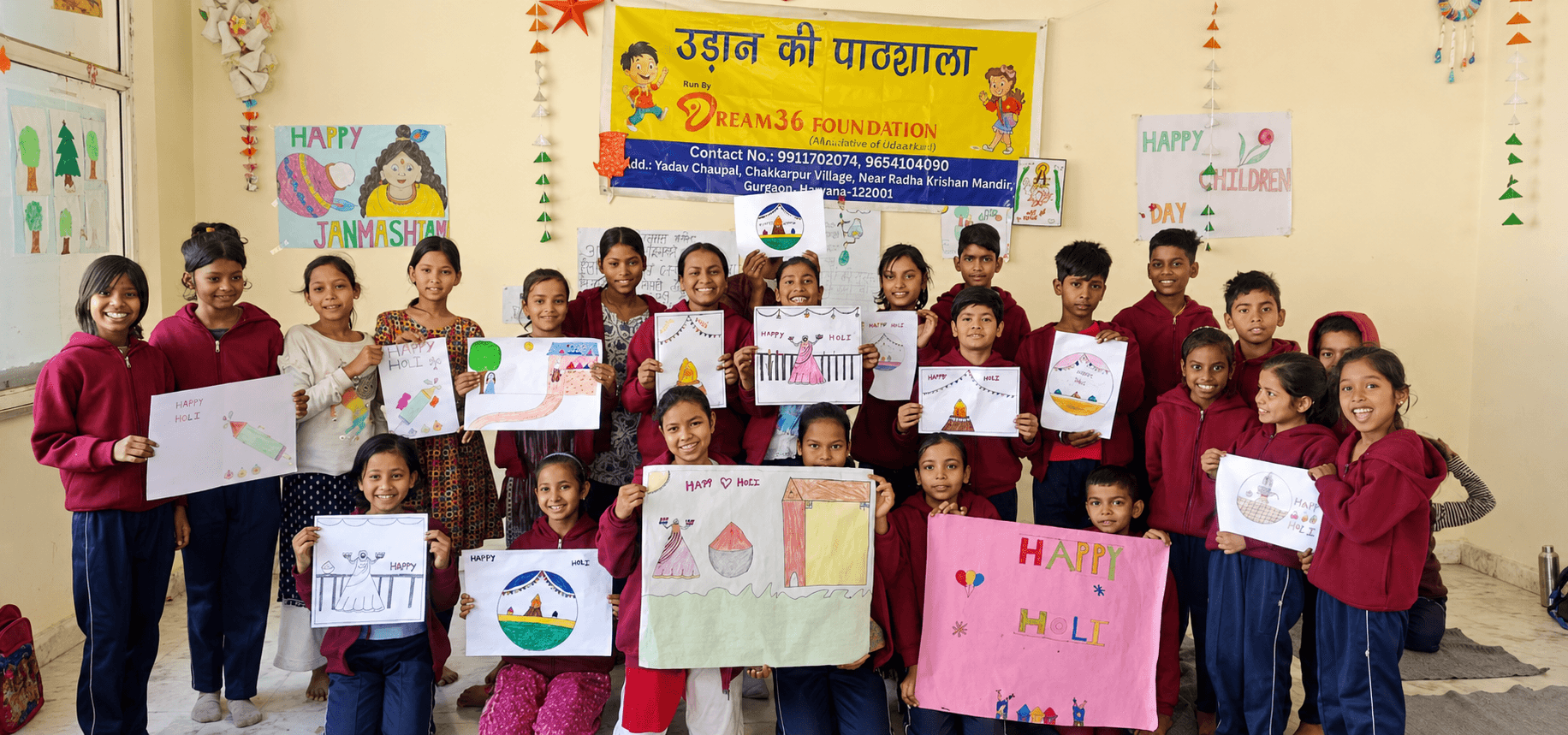 Children studying at small desks at Udaan Ki Paathshala